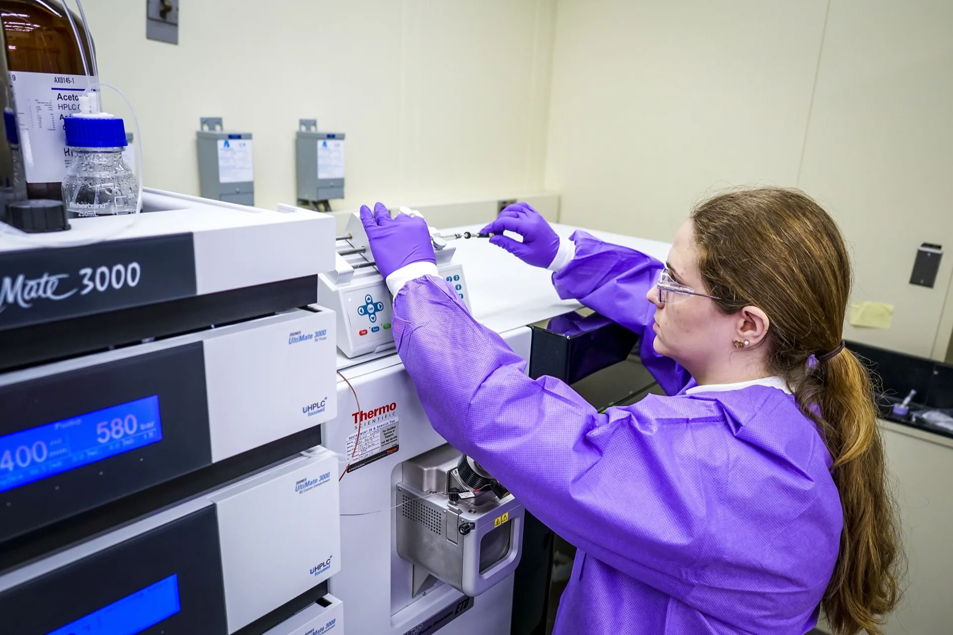 NIST research chemist Kelly Telu injects a sample into a mass spectrometer. Context photograph, not a photograph of the 2023 AI Risk Management Framework release.